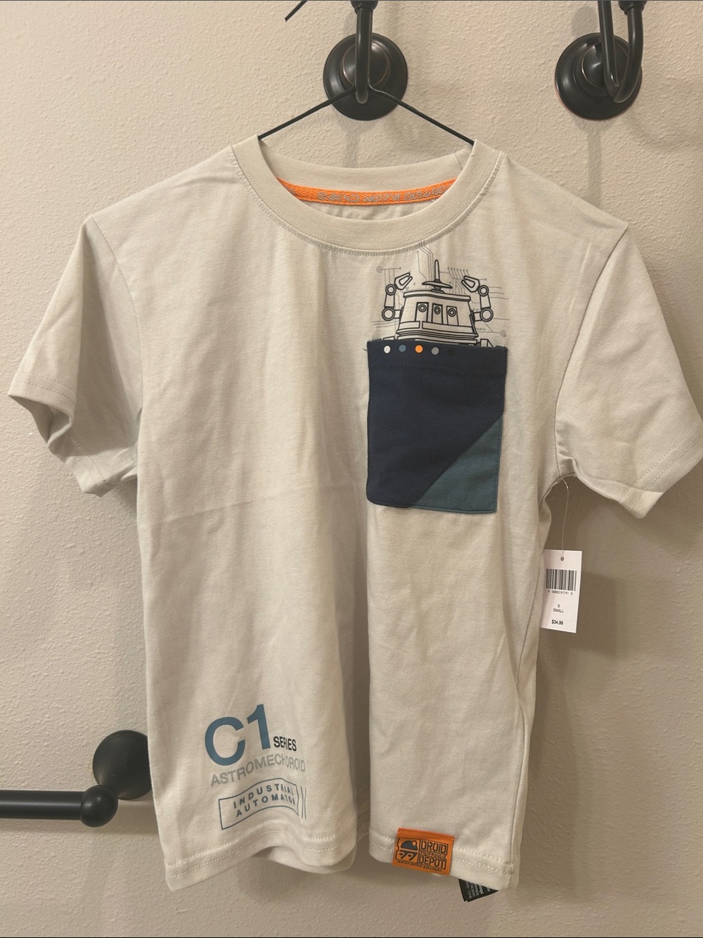 Disney Light Gray Short Sleeve Tee with Navy & Teal Pocket and Orange Trim